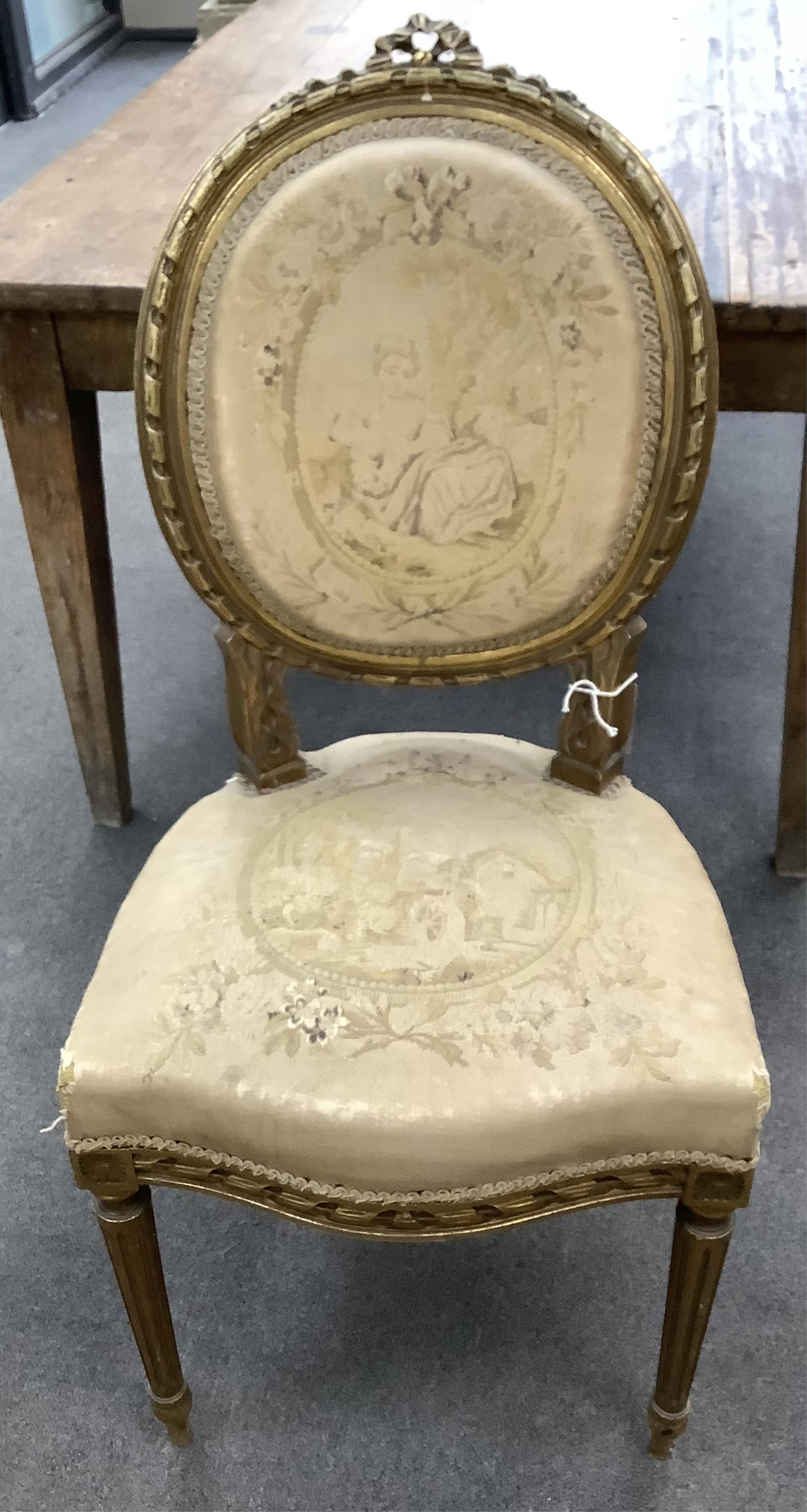 A Louis XVI style giltwood and composition three piece salon suite with tapestry upholstery, settee width 120cm, depth 54cm, height 102cm. Condition - fair